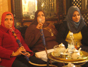 Women smoking Shisha in a back room of a cafe in Cairo